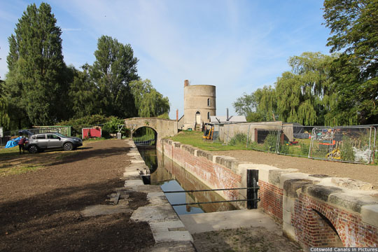 Inglesham Lock with bridge and roundhouse in background
